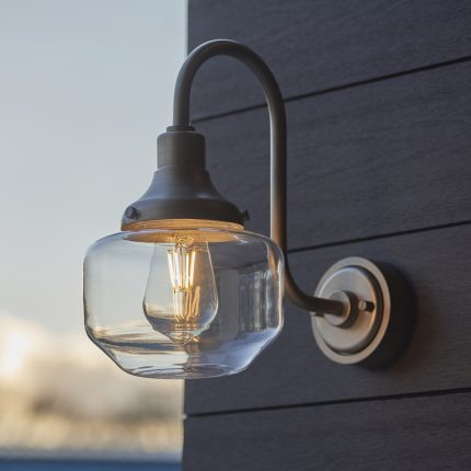 Main side view of the Dune Swan Neck Outdoor Wall Light in pewter, mounted on a house's outside wall.