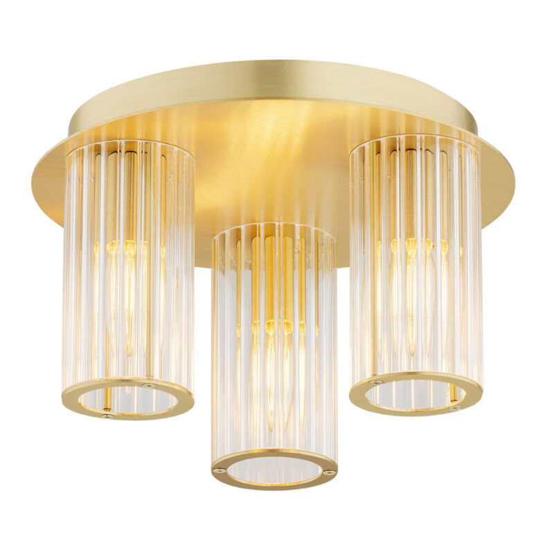 3 light round flush ceiling light in brushed brass with light bulbs on .