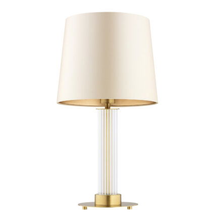 Glass table lamp with beige fabric lampshade switched off.