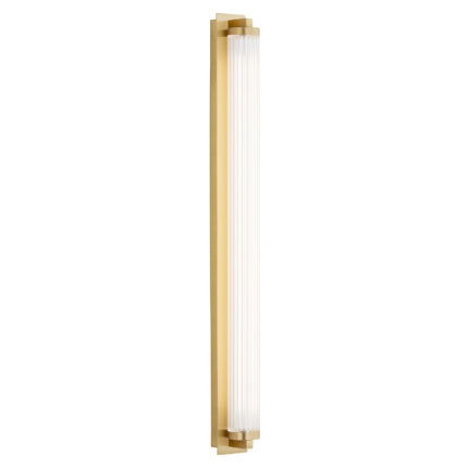 Left side illuminated view of a brass cylinder shaped led wall light.