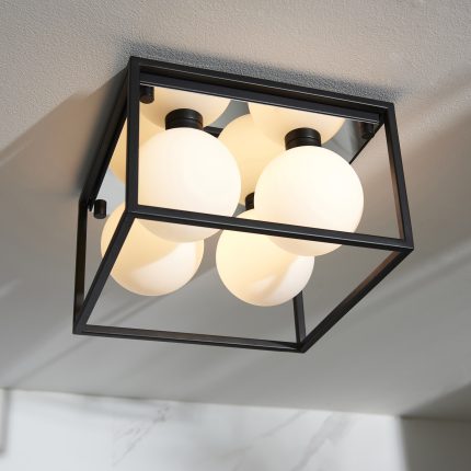 Upward looking view showing the underside of the Vamp Ceiling Light, with four opal glass globes.