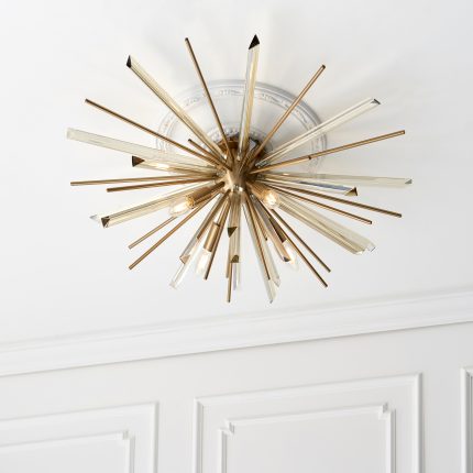 Upward view of the Starburst Ceiling Light, 80cm, with antique brass finish and glass, installed on a white ceiling rose.
