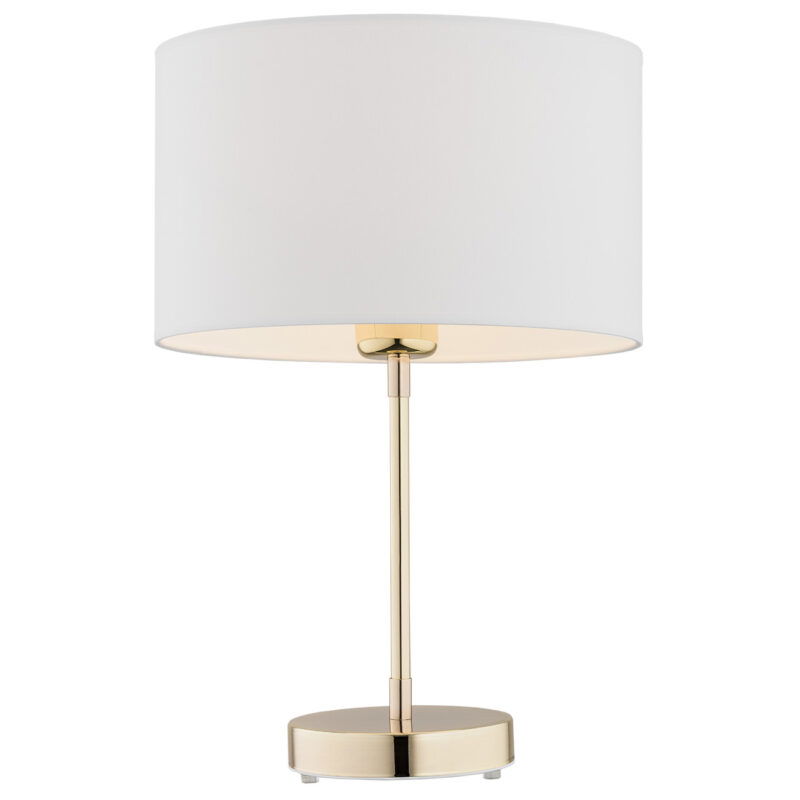 White drum lampshade on a brass table lamp against a white background. 