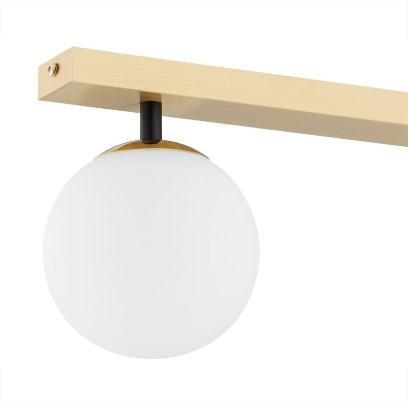 Close-up of Emont light fixture showing round opal glass shade with brass trim on black mounting arm.