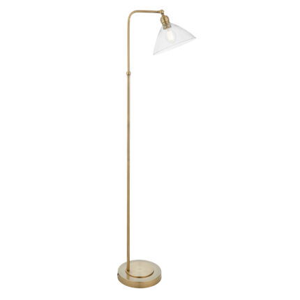 Full-length floor lamp with antique brass frame and illuminated clear glass shade on white background.