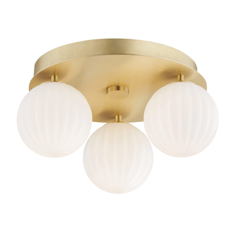 Brass Loma flush ceiling light with three lit opal white glass ribbed shades.