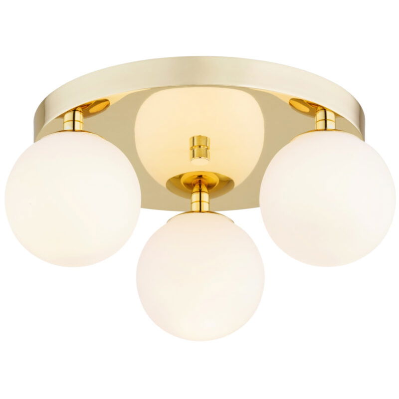 Vio ceiling light illuminated showing warm glow through opal glass spheres.