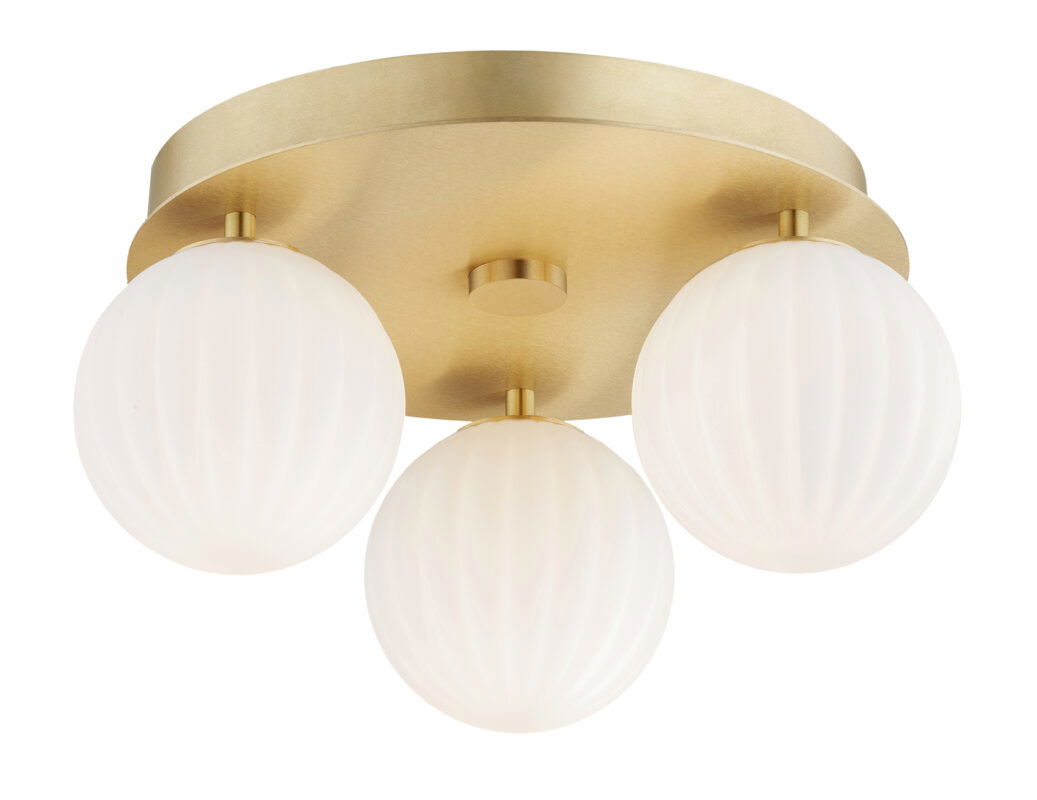 Illuminated brass flush ceiling light with three glowing opal glass spheres on curved arms