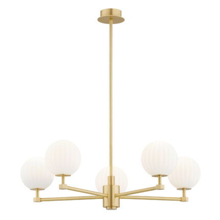 Loma brass chandelier with five illuminated matt opal glass shades emitting warm white light.