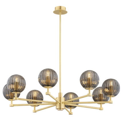 Loma chandelier with all 8 smoked glass globes lit, showing warm light diffusing through smoked glass on brass frame.