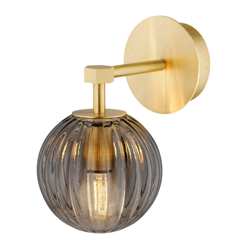 Downward-facing wall light with brass finish and smoked ribbed glass shade.