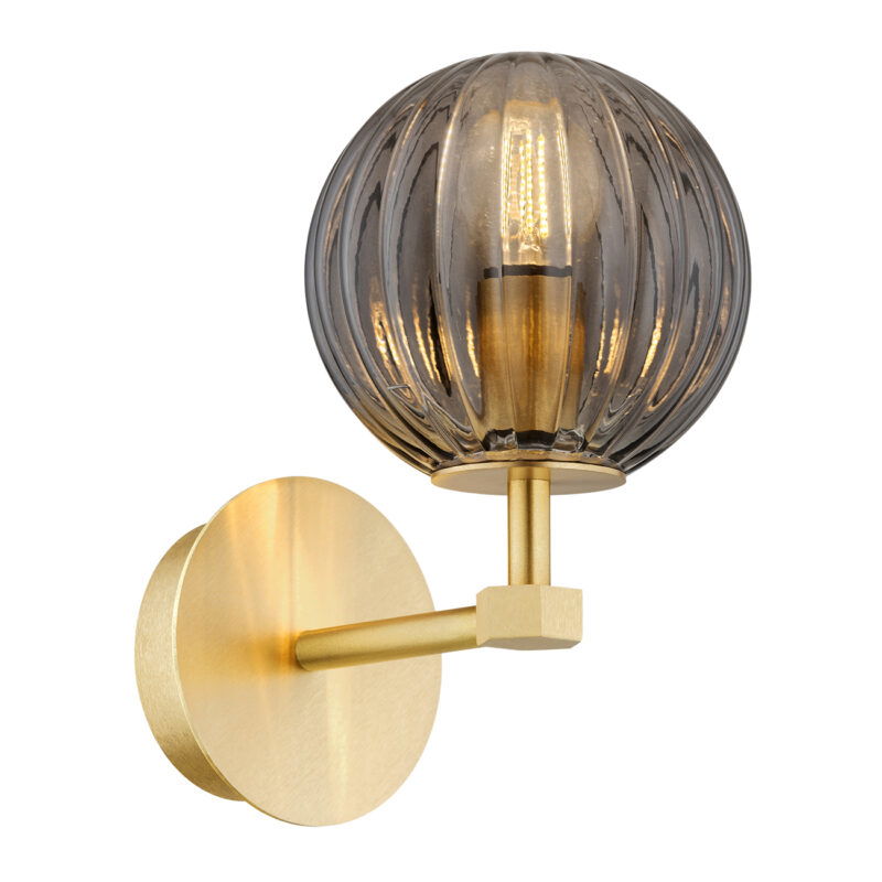 Upward-facing wall light with brass finish and smoked ribbed glass shade.
