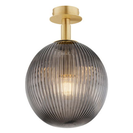 Front view of lit Loma ceiling light showing illuminated single bulb through 25cm smoked glass shade creating diffused glow.