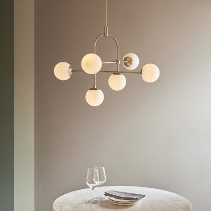 Felix Chandelier, Antique Brass, Opal Glass, 6 Light, 86cm hanging above a dining room table.