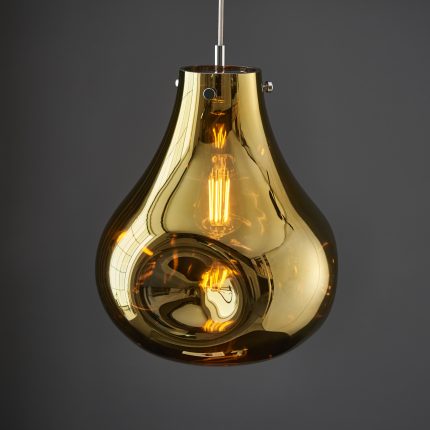 Close-up of the large Wisp Pendant Light's metallic gold glass with a warm white vintage filament light bulb inside.