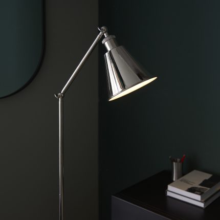 Close-up side angle view of the top half of the Alia Floor Lamp in polished nickel, focusing on its adjustable head.