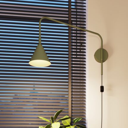 Green wall light with plug on a wall.