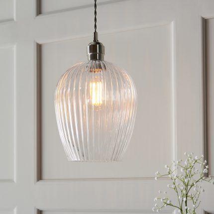 Zoomed in view of the ribbed clear glass on the Nico Small Pendant Light with polished nickel finish.