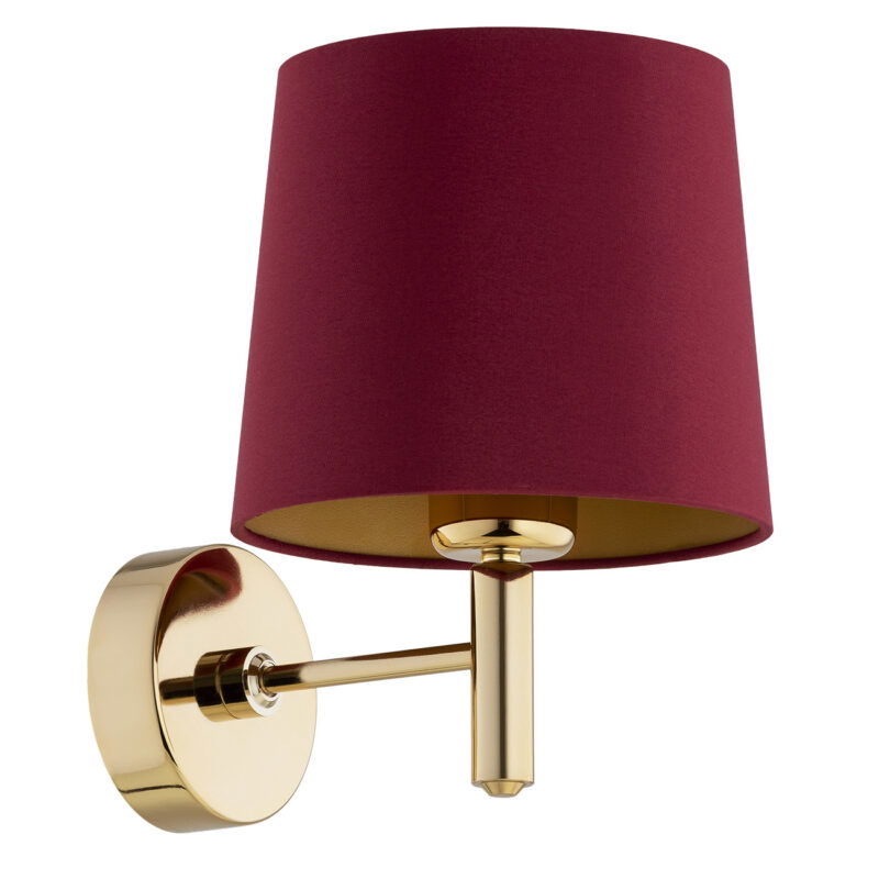 Brass wall light with red shade with the light bulb switched off.