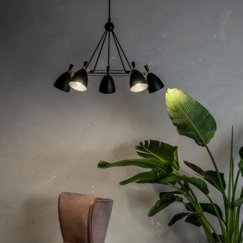 Harlot 5 light chandelier in room setting with black bell shades.