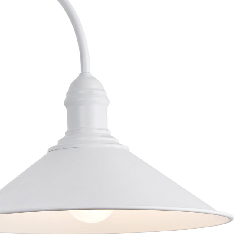 Close-up of white conical shade with decorative ridging on the Terba wall lamp.