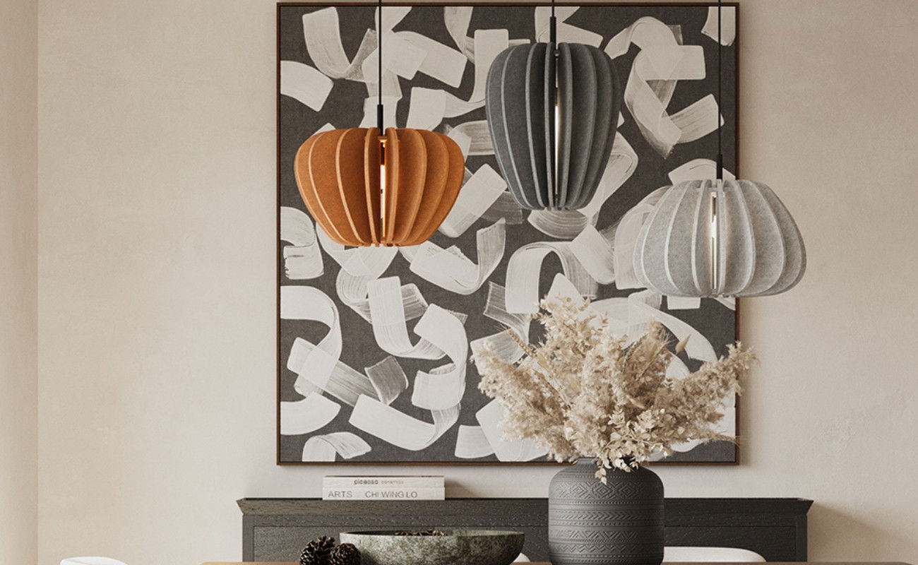 Image of 3 pendant over a dining table.