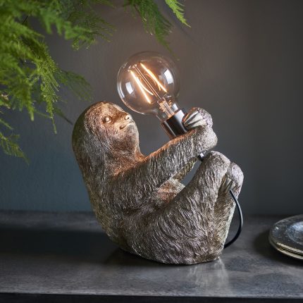 Mirth The Sloth Table Lamp, Vintage Silver, displayed on a side table.