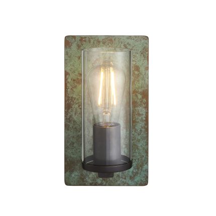 Wall light with oxidized bronze finish and clear glass shade mounted against white background.