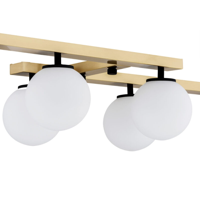 Close-up view of Emont 6-light fixture with brass bars and opal glass shades.